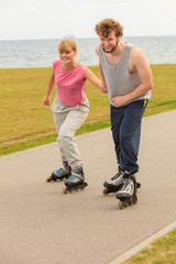 roller skater couple skating outdoor