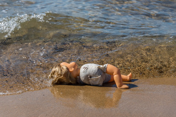 Old Doll Washing Ashore on a Mediterranean Beach