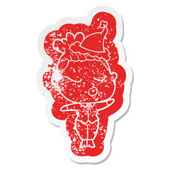 cartoon distressed sticker of a calm woman wearing santa hat