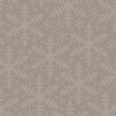 big and small snowflakes on a brown background