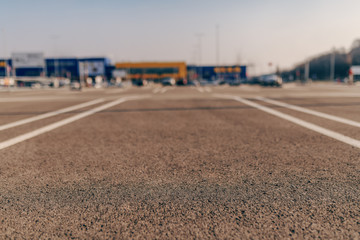 Picture of parking lot at daytime. In background big yellow and blue store. © Dusan Petkovic