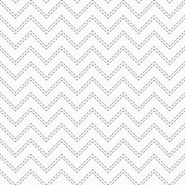 Abstract seamless pattern of dotted zigzag lines.