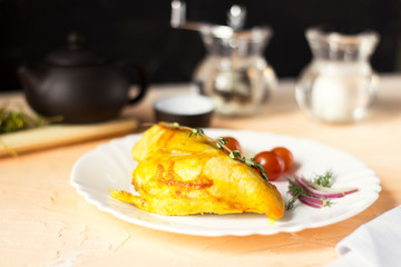Baked chicken breast with onions and tomatoes on a white plate. Healthy food.