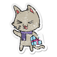 distressed sticker of a cartoon hissing cat with christmas present