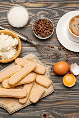 Ingredients for cooking tiramisu - Savoiardi biscuit cookies, mascarpone, cream, sugar, cocoa, coffee and egg