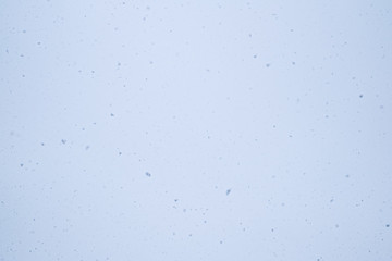 Winter sky with falling snow