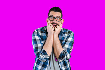 Frightened man stood with a frightened look on his face