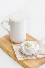 Low-calorie dessert Pavlova with a cup of coffee