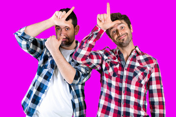 Person making loser sign