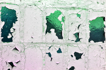 Cracked soft paint on dark green tiles, grunge horizontal shabby background detail close up