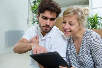 couple with clipboards