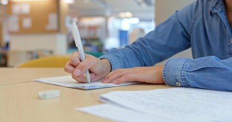 Woman do her homework at library