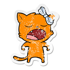 distressed sticker of a cartoon yawning cat