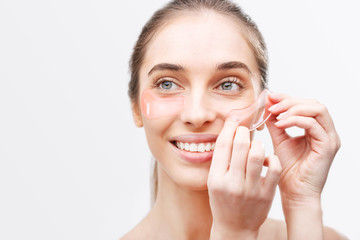 A woman under the eye patches for eye care