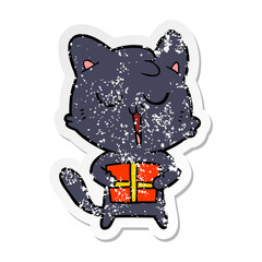 distressed sticker of a cartoon cat with present