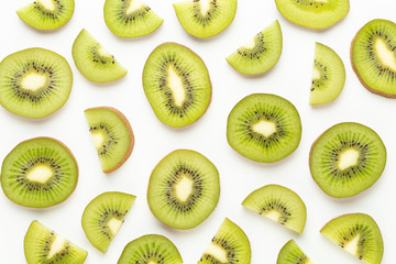 Fototapeta premium Kiwi fruit slices on white background.