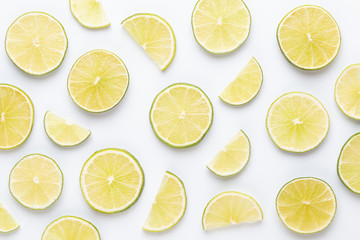 Lime fruit slices on white background.