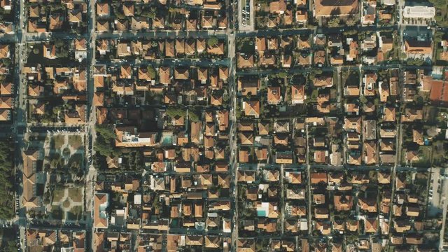 Aerial top down view of tiled roofs of luxury villas and gardens in Forte dei Marmi. Tuscany, Italy
