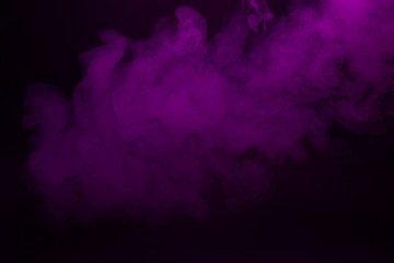 Colorful smoke close-up on a black background