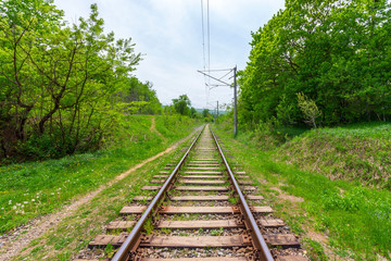 railway rails with wooden sleepers on a summer or spring day