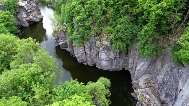 Ukrainian canyon in the village of Buki bird's-eye view. Drone removes from the height of the canyon of the Buka River, white cliffs, meadows, trees.