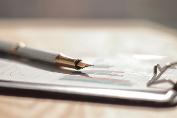close up.fountain pen on the table at the businessman.photo with copy space