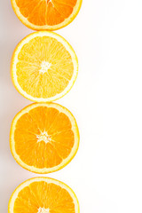 slices of fresh orange on white background