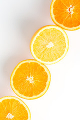 slices of fresh orange on white background