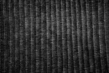 Black real rattan pattern. Background of basket structure close-up. Furniture backdrop.