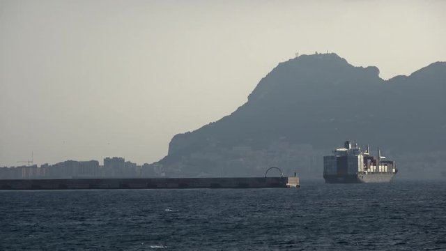 Various shots and angles of Gibraltar from Getares beach. Ships in the busy shipping lanes that enter Gibraltar. Location of frequent disputes between Spain and Gibraltar over ocean territories.