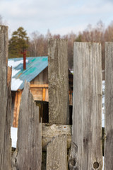 Old rustic fence. Gray wooden rustic fence 