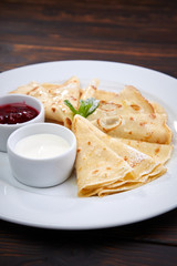 pancakes with sour cream and berry sauce