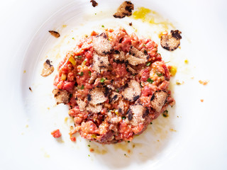 top view of beef steak tartare with truffle