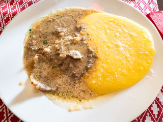 top view of Manzo all'Olio with polenta on plate