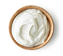 sour cream or yogurt in wooden bowl - obrazy, fototapety, plakaty