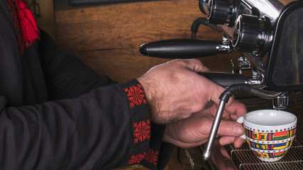 Barista cooks coffee. Hot drink