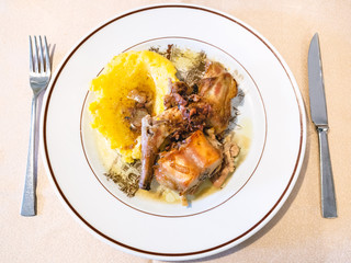 Italian cuisine - top view of Rabbit with Polenta