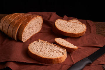 freshly baked bread on dark wooden kitchen table. Selective focus