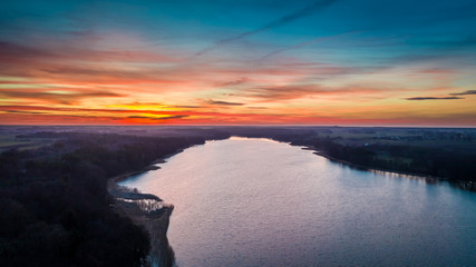 Obraz premium Aerial view of melting ice on lake at dusk