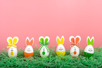 Easter eggs cute bunny on blue backgroung. Funny decoration. Happy Easter concept