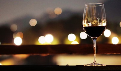 glass of wine in front of fireplace