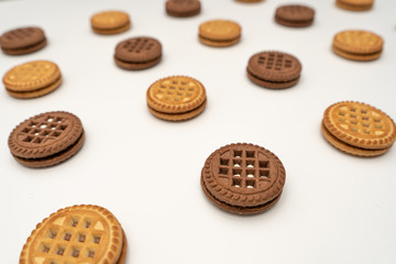 Close-up of delicious cookies with cream for breakfast on a white background. Perspective