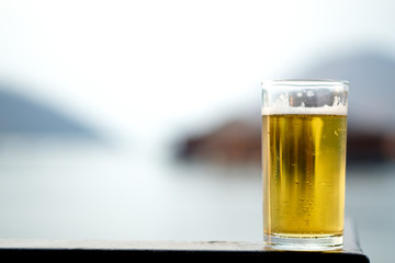 Fresh of beer in long glass with nature background