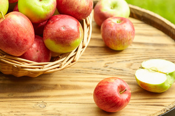 apples on garden background on the old barrel