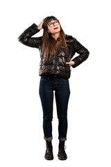 Full-length shot of Woman with glasses having doubts while scratching head