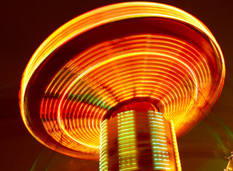 The lights on the carousel in motion