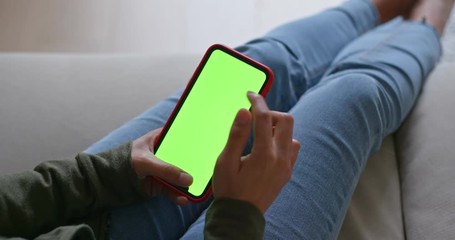 Woman hold with cellphone with green screen