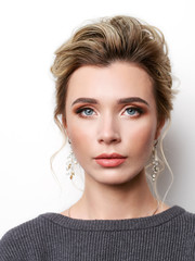 Portrait of beautiful elegant girl with blond hair, trendy styling, beautiful makeup, glossy, smooth skin posing for makeup artist social network portfolio