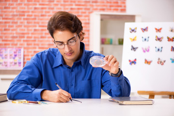 Student entomologist studying new species of butterflies 