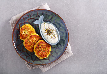 Zucchini and cheese fritters with herb yogurt